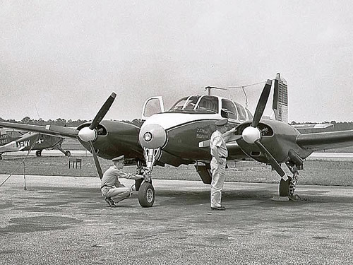 U-8F Seminole being inspected at an airfield.