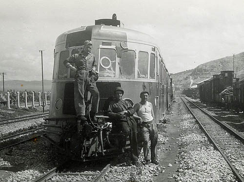 Soldiers in front of a train.