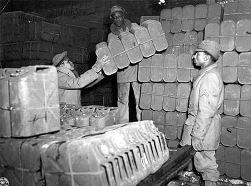 African-American Soldiers loading Jerry Cans.