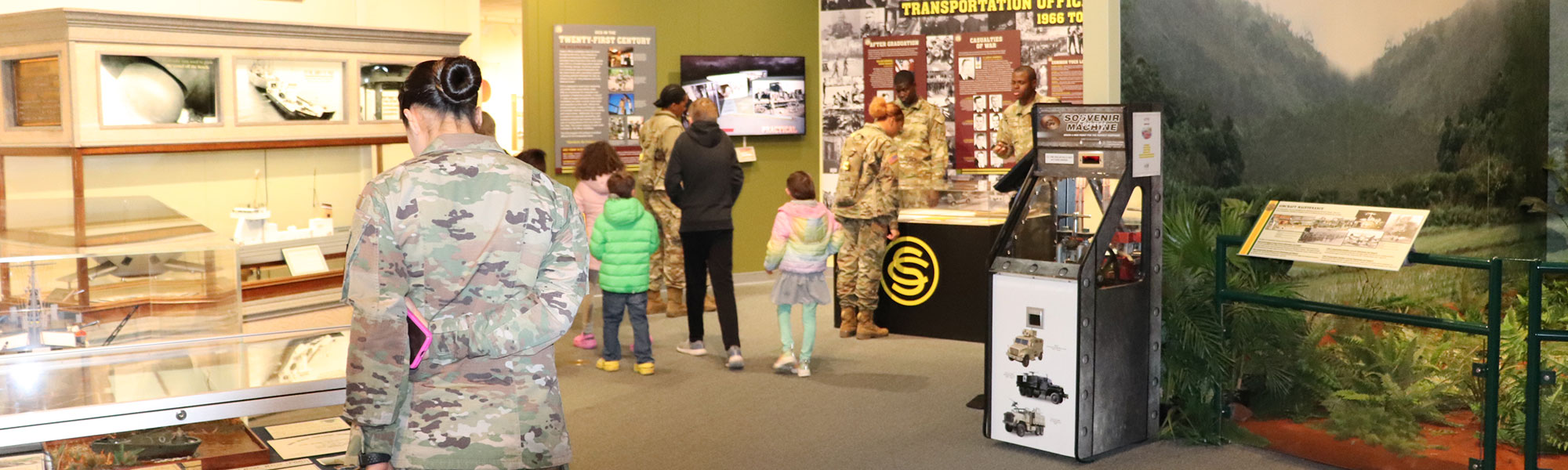 An image of the TC OCS exhibit with soldiers and civilians lookting at exhibit.